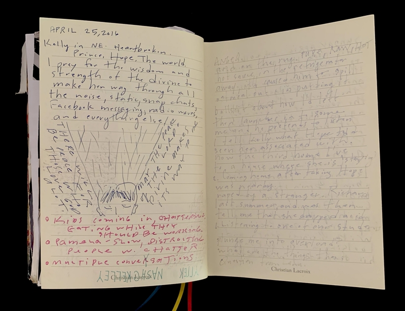 Open journal with handwritten notes and a sketch.