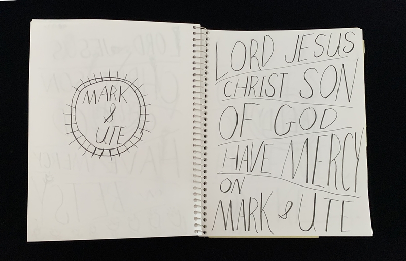 A handwritten page with a circular doodle and text prayers.