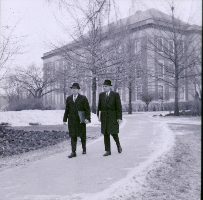 Original caption: "Chancellor Hardin and Joseph Soshnik walking in front of library."