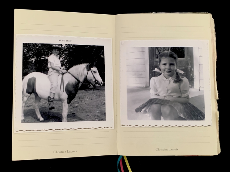 Open journal with two black-and-white photographs; a child on a horse from 1958 and a girl sitting on a porch.