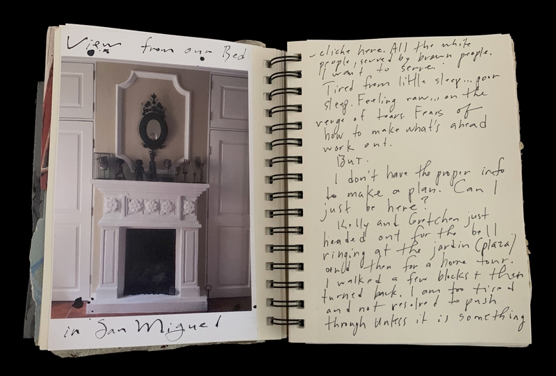 A journal page featuring a photograph of a fireplace and handwritten reflections on travel and emotions.