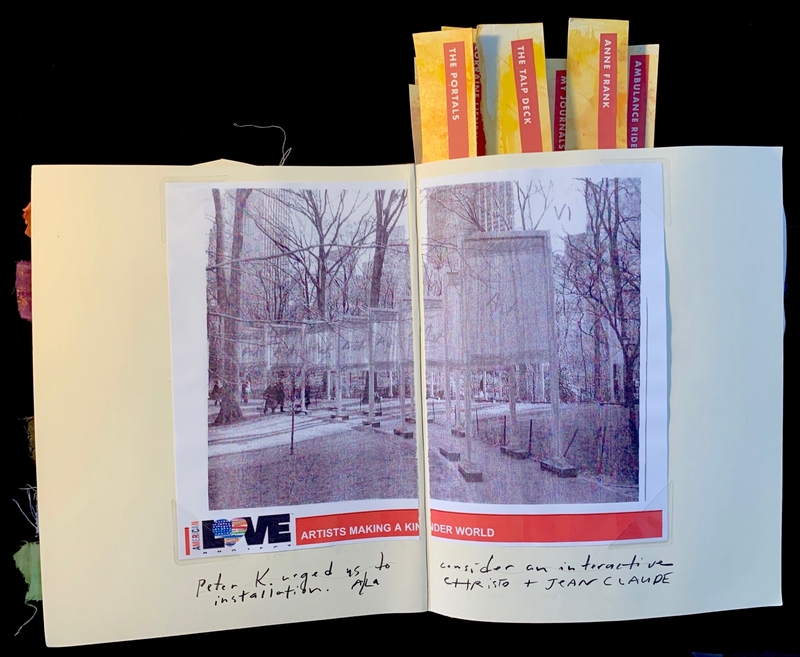 Open journal with photographs, colorful tabs, and handwritten notes.