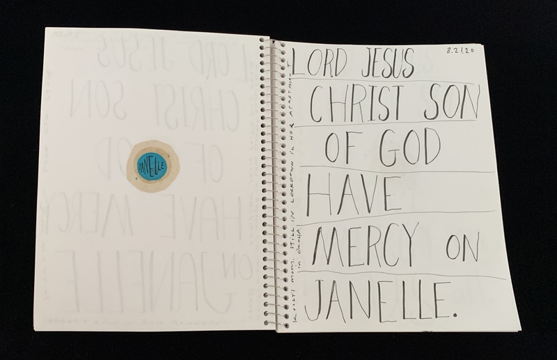 A handwritten prayer page with a circular sticker and a prayer for Janelle.