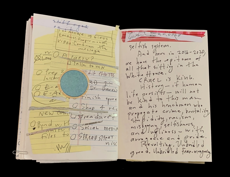 Open notebook with handwritten notes on both pages, including tasks and a political commentary.
