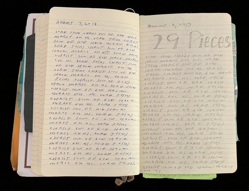 An open notebook with handwritten entries in blue ink and pencil, dated August 7 and 8, 2013.