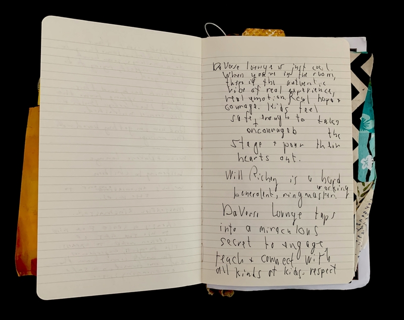 Open notebook with handwritten text on the right page.