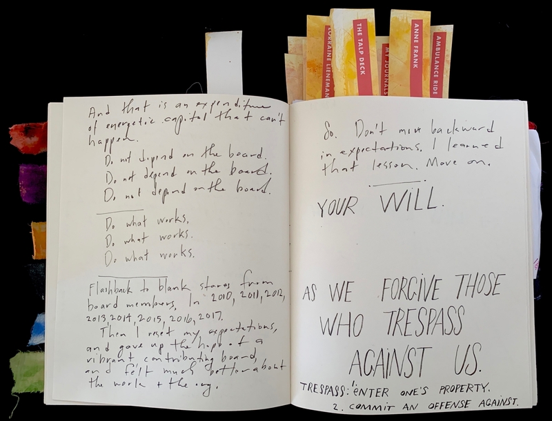 Open journal with handwritten notes and colorful bookmarks at the top.