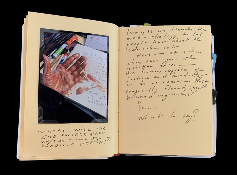 A handwritten page with a Polaroid photo of a hand and various notes and questions.