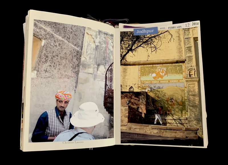 Open book showing photographs of a man in a colorful turban and historic architecture in Jodhpur, dated February 12, 2014.
