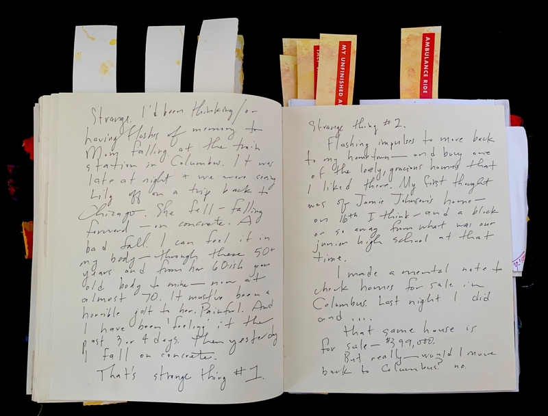 Open journal with handwritten text in cursive on two pages, discussing memories and thoughts about moving.