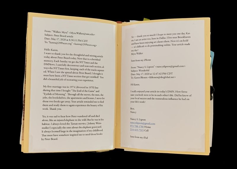 A photograph of an open book with two pages containing handwritten text.