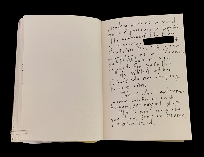 Open book with handwritten text on the right page.