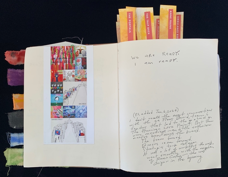Open journal with colorful artwork on the left page and handwritten text on the right page.