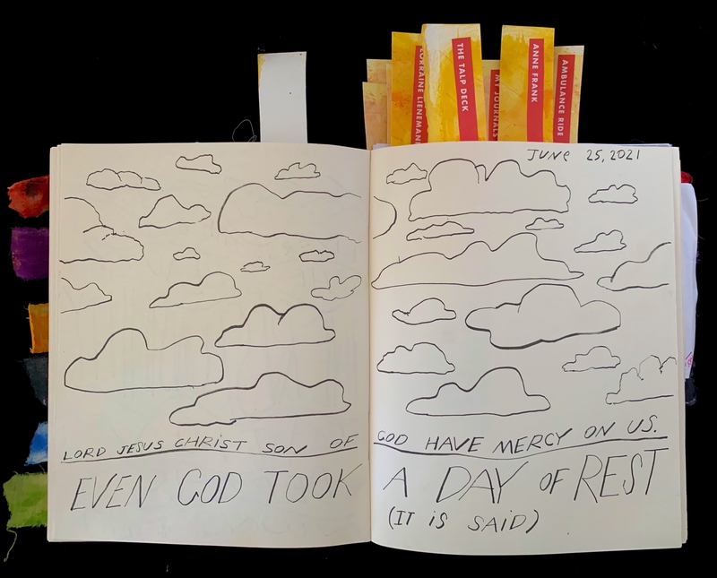 Open journal with cloud drawings and handwritten text, dated June 25, 2021.