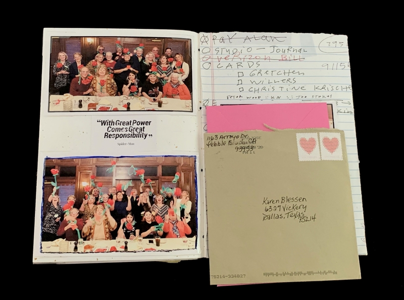Open notebook with group photos and handwritten notes, accompanied by a stamped envelope.