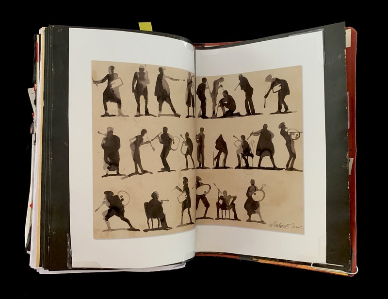A page from a sketchbook featuring detailed silhouettes of musicians and dancers.