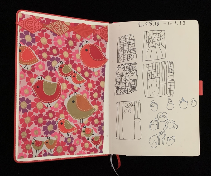 An open notebook with colorful bird art on the left and black ink sketches on the right.