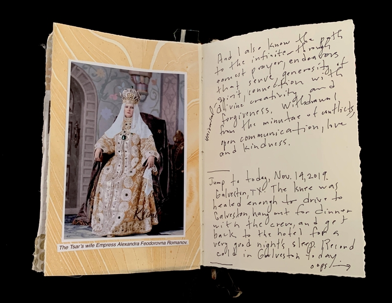 An open journal with a photo of Empress Alexandra Feodorovna on the left page and handwritten cursive text on the right.