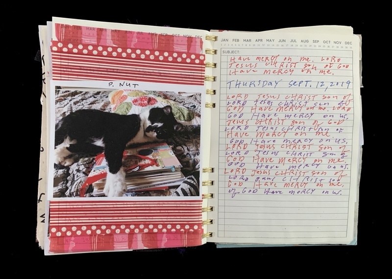 A journal page featuring a photograph of a black and white dog named "P. Nut" and handwritten prayers.