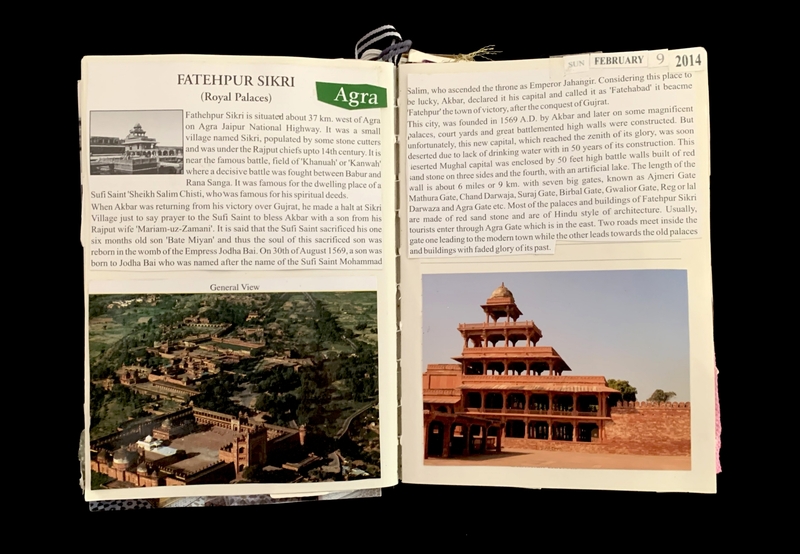 An open book with pages about Fatehpur Sikri, featuring text and photos of historical buildings.