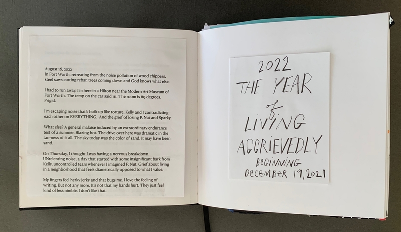 A journal page with handwritten text and a note titled "2022 THE YEAR OF LIVING AGGRIEVEDLY BEGINNING DECEMBER 19, 2021."