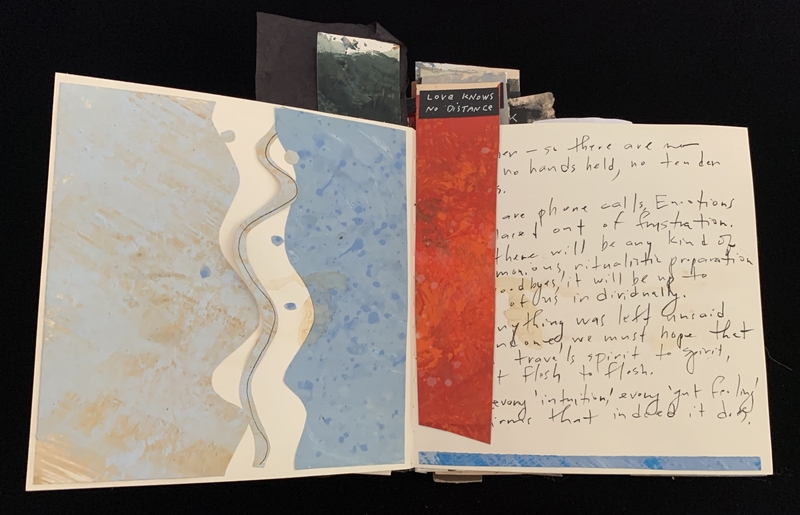 Open book with abstract designs and handwritten text on overlapping pages.