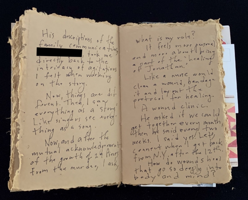 An open aged journal with handwritten text on yellowed pages discussing family communication and healing.