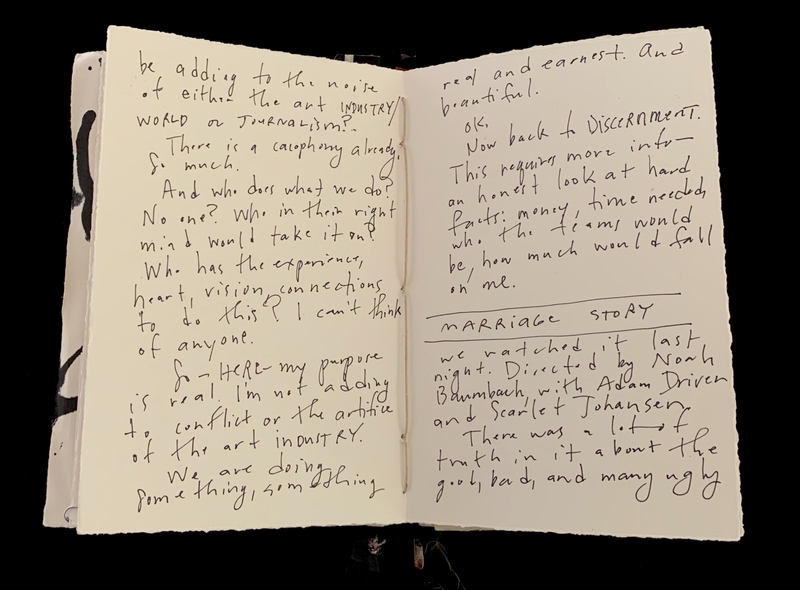 Open notebook with handwritten notes discussing noise in the art industry, discernment, and a review of the movie "Marriage Story."