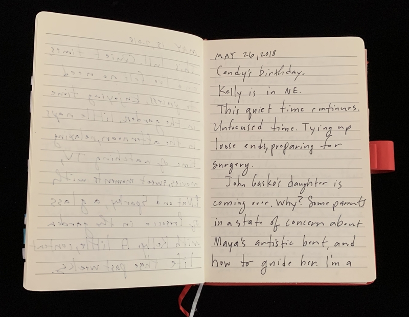 Open notebook with handwritten entry dated May 26, 2018.