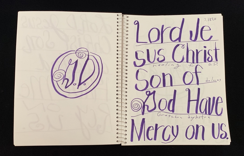 A page from a notebook featuring a circular doodle and handwritten text.
