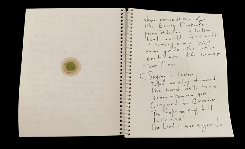 A handwritten page with a small circular doodle and a quote from Emily Dickinson.