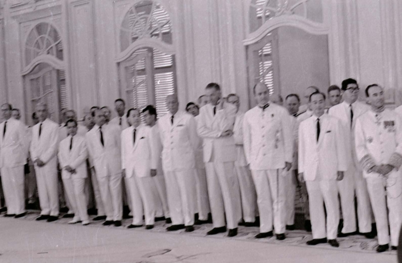 Nguyá»…n KhÃ¡nh at a formal meeting. He is among a line of men.