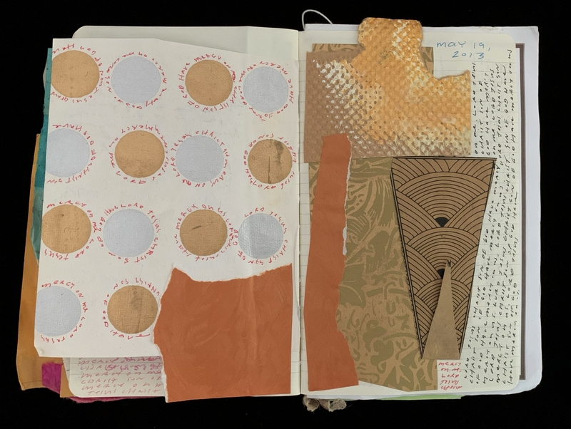 Open notebook with collage and handwritten elements.