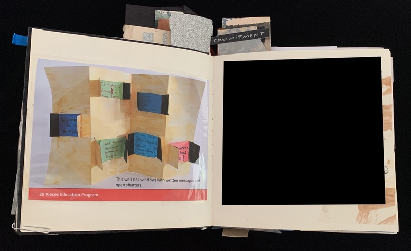 Open scrapbook showing a display with colorful message windows and a black rectangle on the right page.