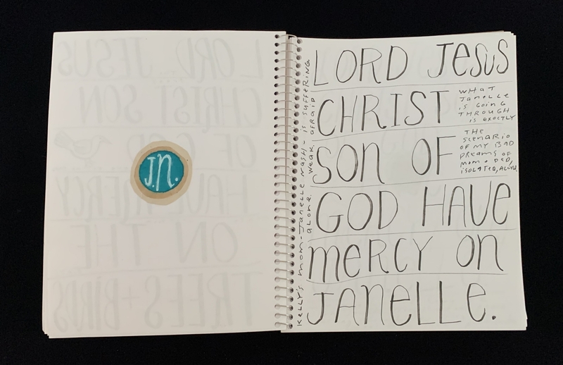 A handwritten prayer page featuring the name "Janelle" and a circular sticker with "JN" on it.