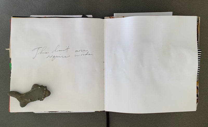 A simple journal page with a small sculpture and handwritten text.