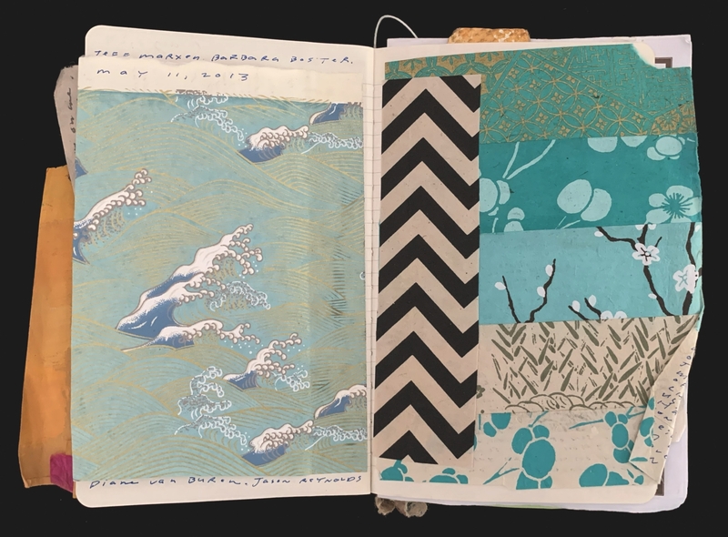 Open notebook with pages showing ocean waves and a collage of patterned papers.