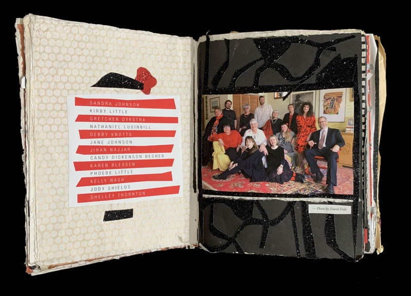 Open book with red and white text list on left page and group photo on right page.