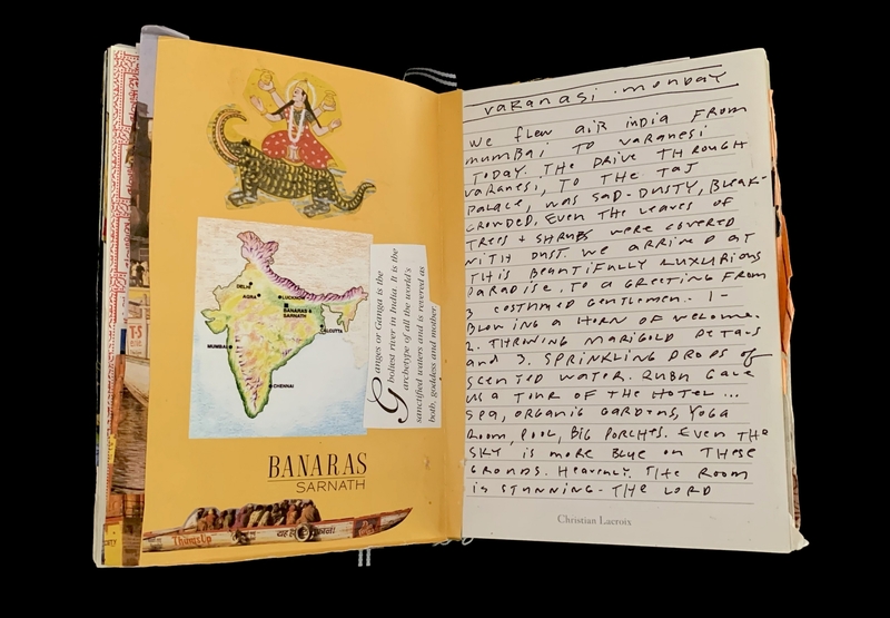 Open notebook with collage on the left page featuring a map of India and handwritten notes on the right page.