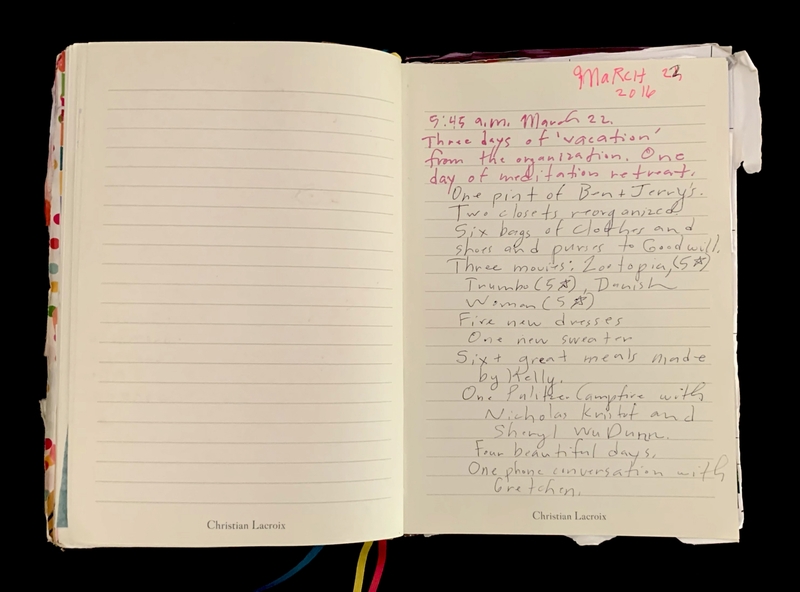 An open journal with handwritten text on the right page and a blank lined page on the left.