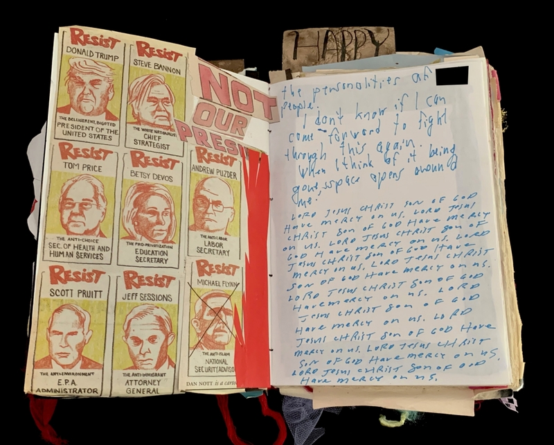 A political protest comic and handwritten notes on a scrapbook page.