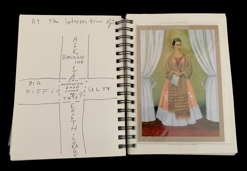 A notebook page featuring a doodle and a photograph of a woman in traditional attire.