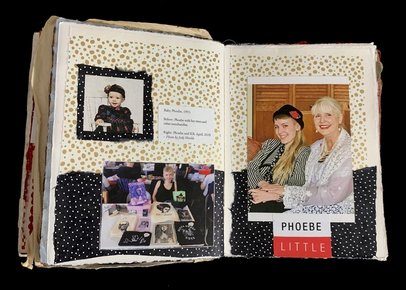 Open scrapbook with photos and a label reading "PHOEBE LITTLE."