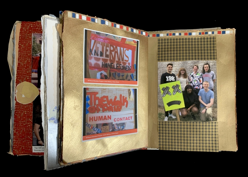 Open scrapbook with photos and a cartoon-like sign.