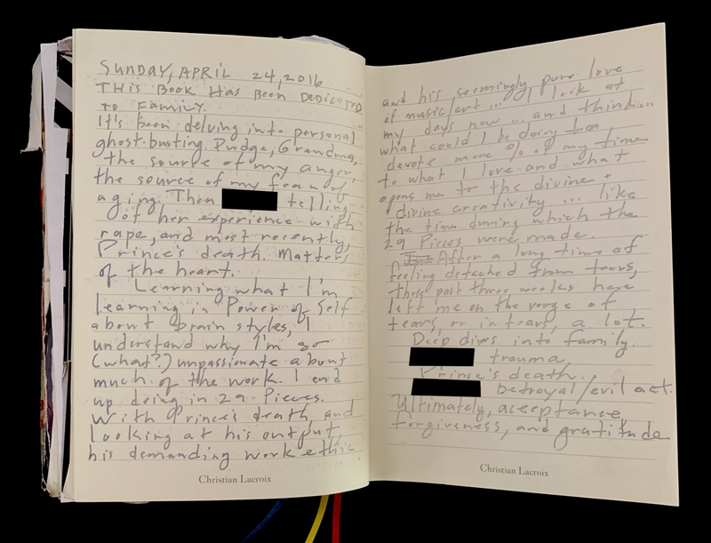 Open journal with handwritten entries and colorful ribbon bookmarks.