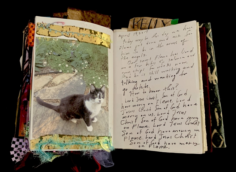 A scrapbook page featuring a photograph of a cat and handwritten text expressing grief and remembrance.
