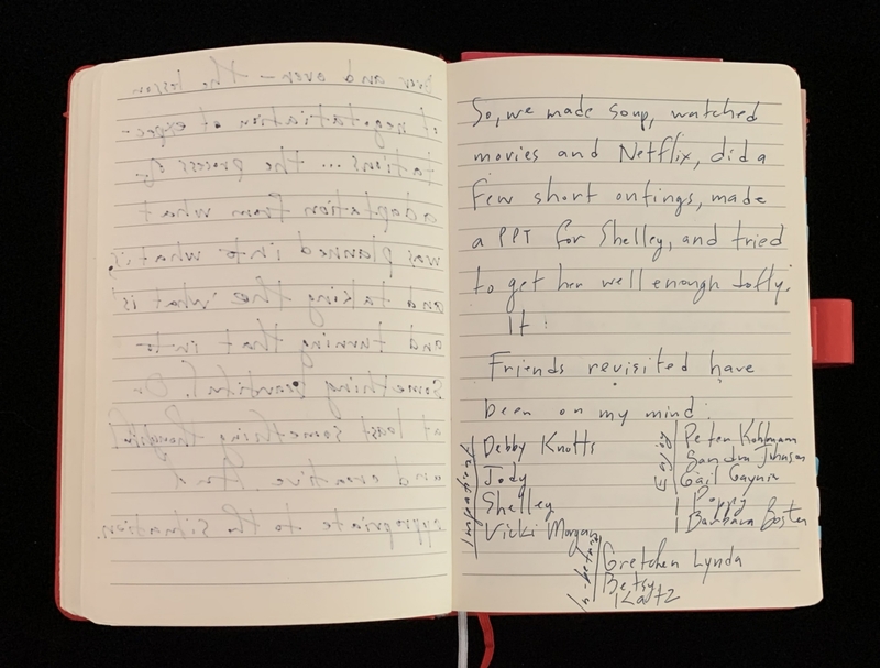 Open notebook with handwritten text on both pages; the right page is more legible than the left.