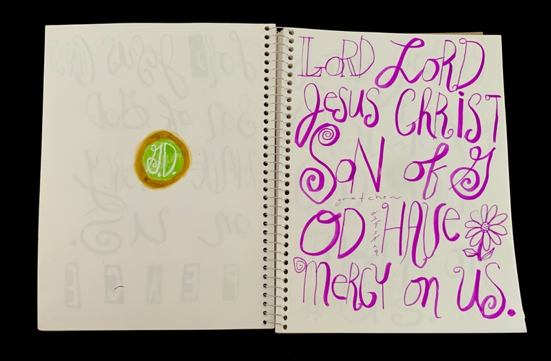 A page from a notebook featuring a circular doodle and handwritten text in purple ink.