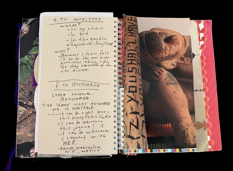 A journal page with handwritten notes and a photograph of a statue.
