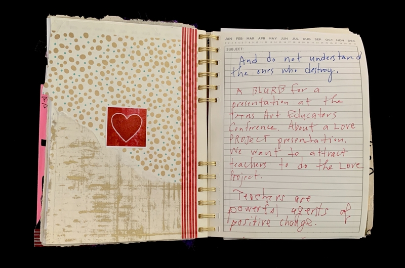A handwritten note in a spiral-bound notebook with a decorative cover featuring a red heart and polka dots.